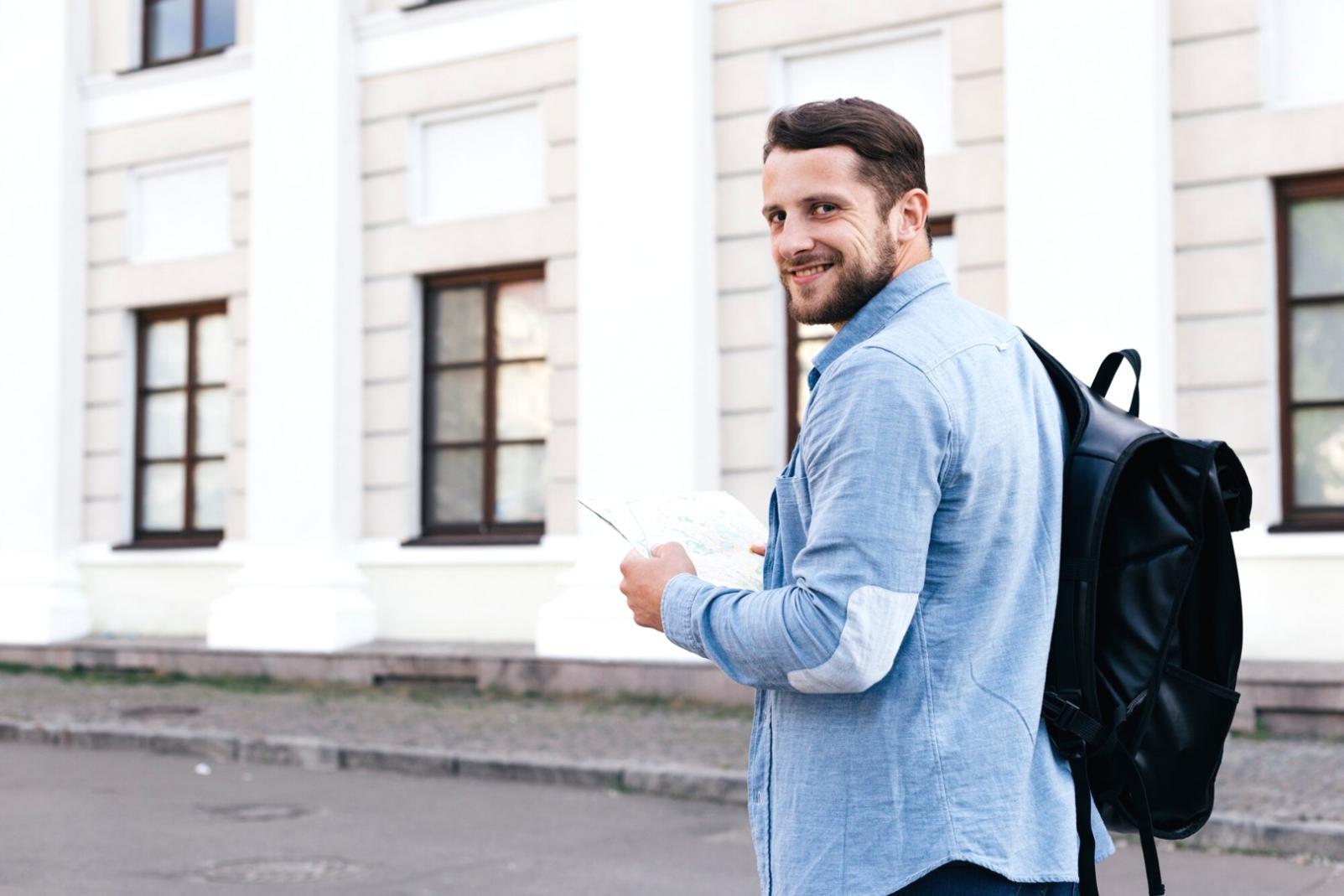 Person reviewing financial documents and benchmarking reports